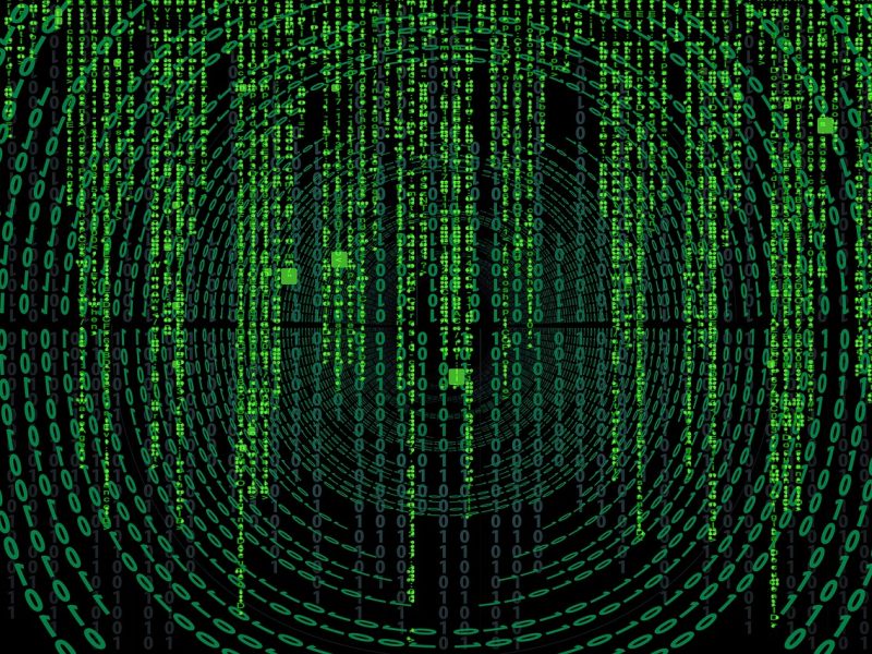 Een afbeelding van een groene matrixcode op een zwarte achtergrond.
